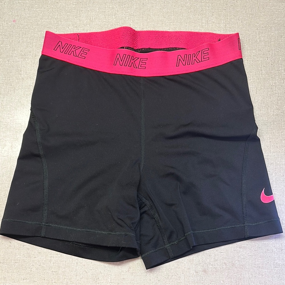 Pink and black Nike Pros